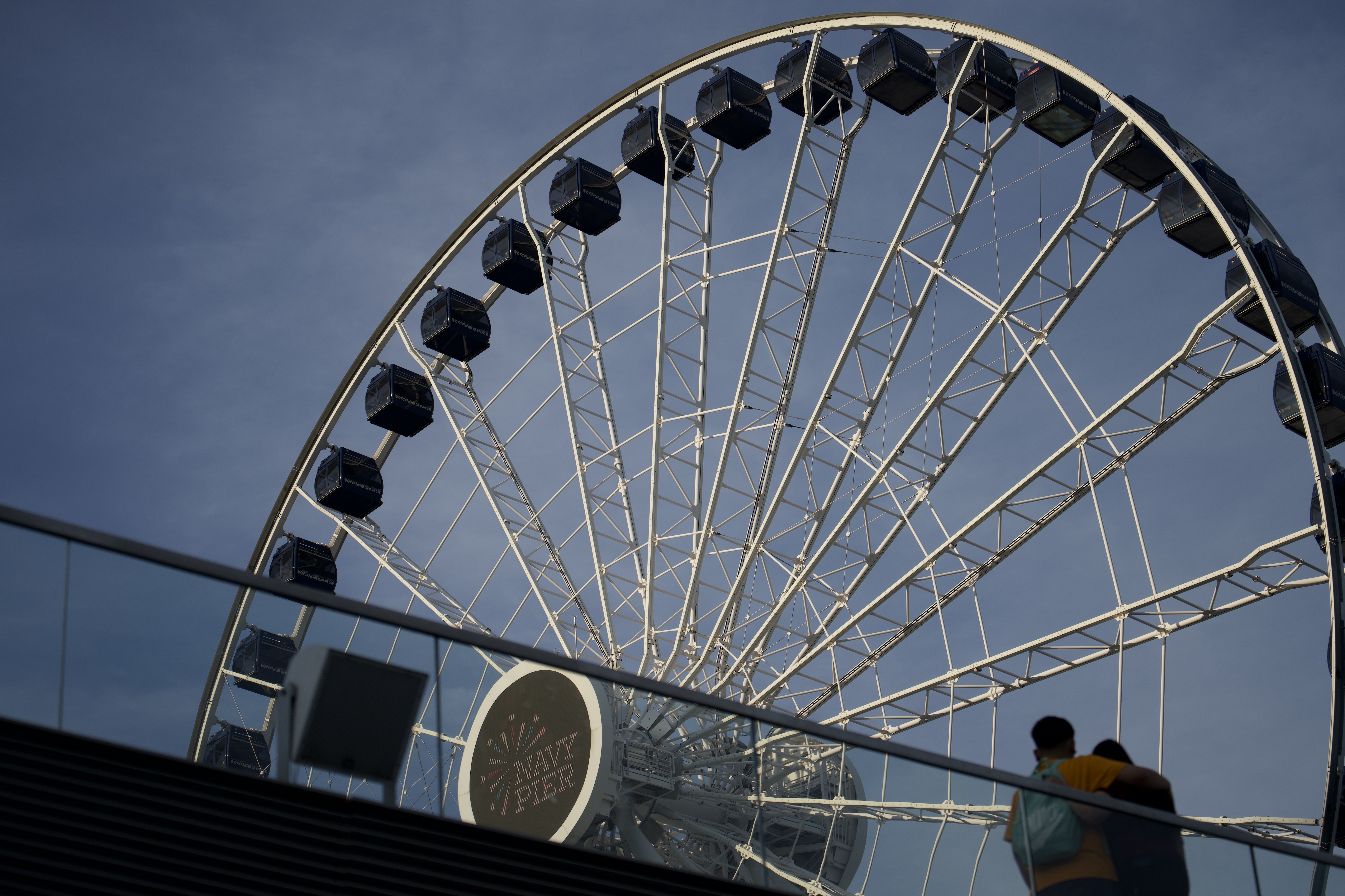 Navy Pier Ferris wheel against a grey-blue sky, Navy Pier logo visible on the hub